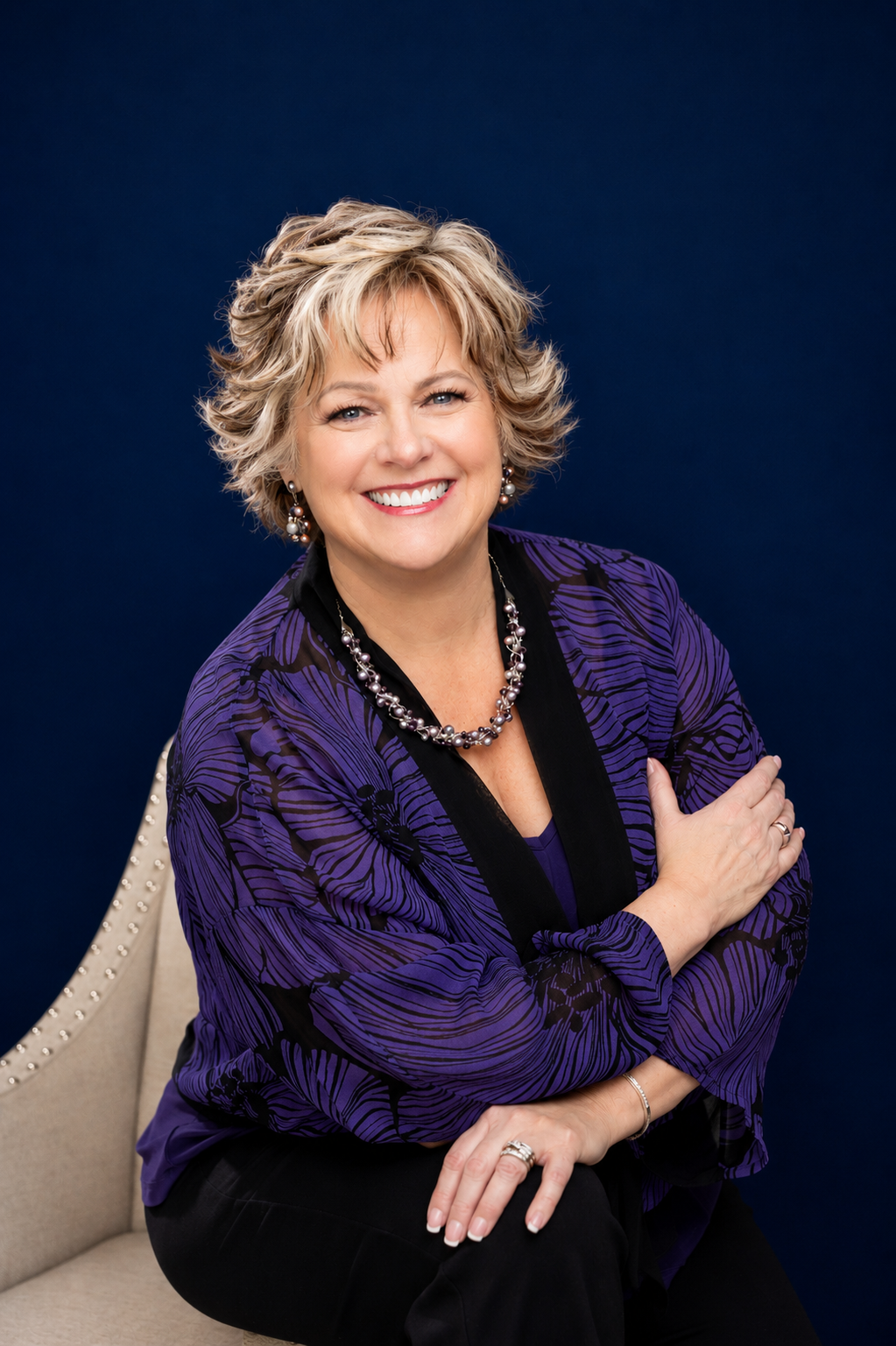 Dr. Lauran Star — Blue background portrait